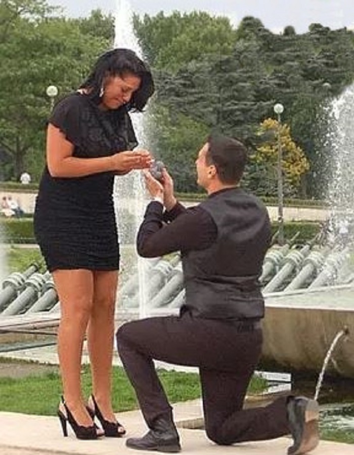Ryan on his knees to propose the love of his life, Sara Ramirez. 